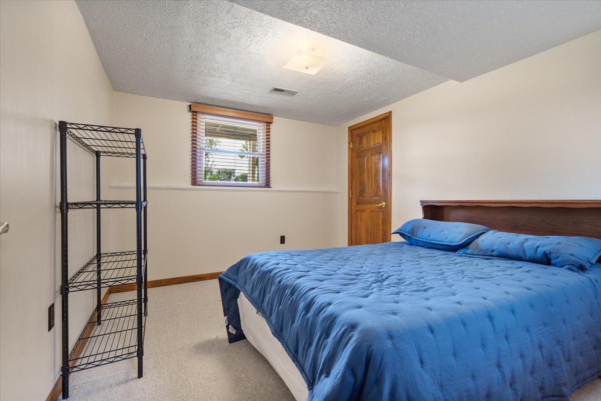 13310 Tango Road Bloomington, IL 61705 - Photo 24 of 40 a bedroom with a bed and a window