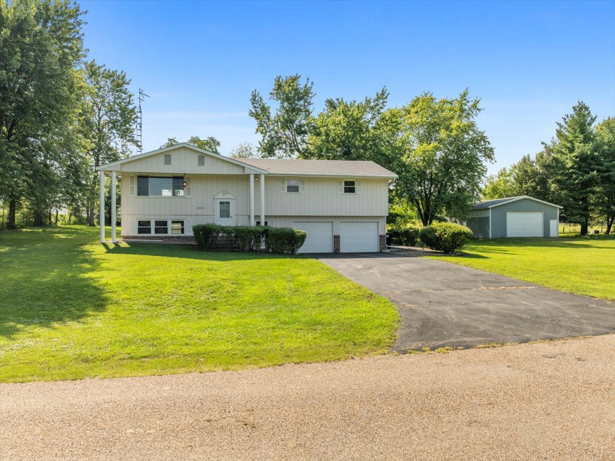 13310 Tango Road Bloomington, IL 61705 - Photo 3 of 40 a front view of a house with swimming pool