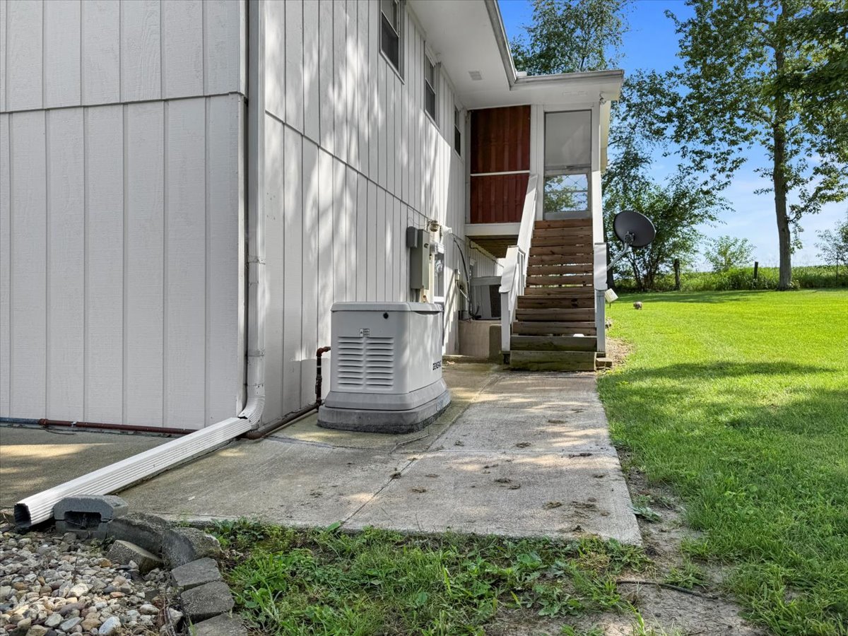 13310 Tango Road Bloomington, IL 61705 - Photo 37 of 40 a view of a house with backyard and wooden fence