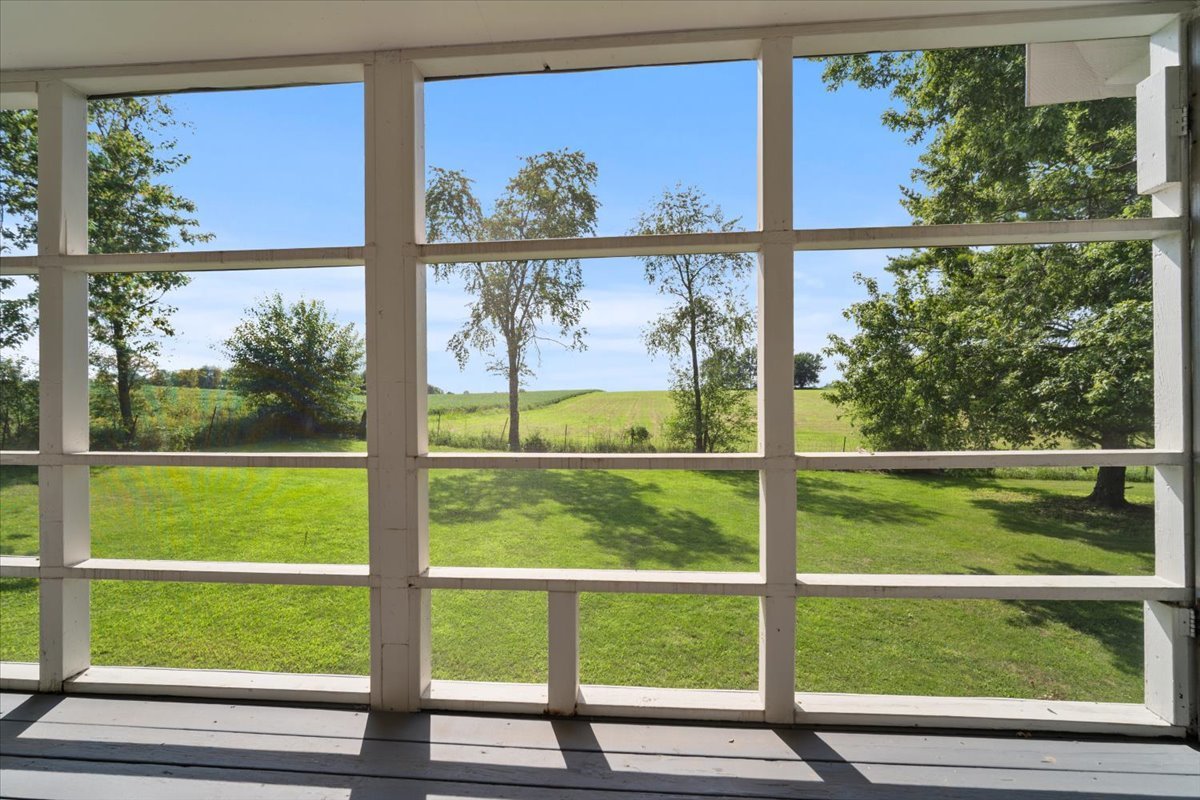 13310 Tango Road Bloomington, IL 61705 - Photo 7 of 40 a view of a back yard from a window