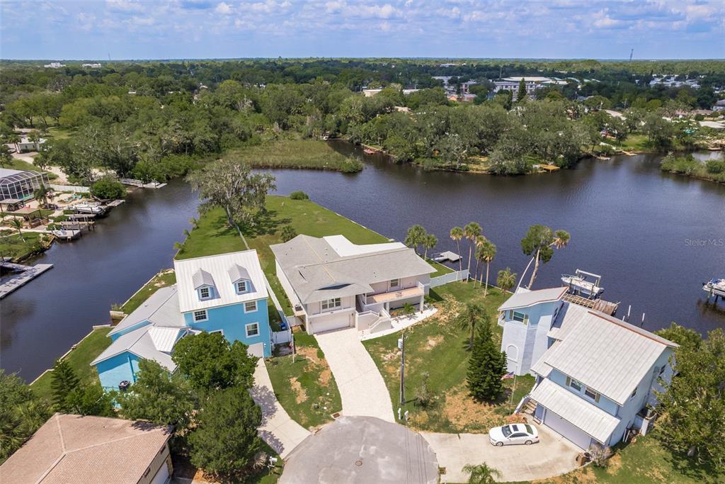 5534 Tropic Drive New Port Richey, FL 34653 - Photo 2 of 32 an aerial view of a house with a lake view