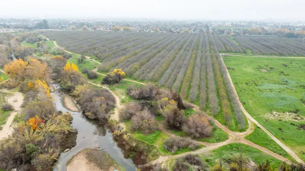 a view of a lake with a yard