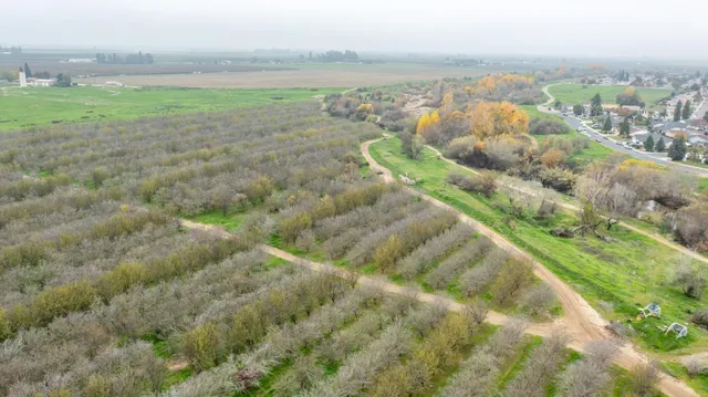 a view of a lake with a yard