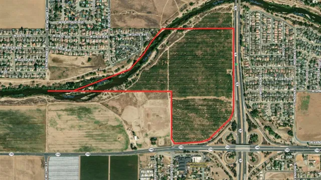 a aerial view of residential houses with outdoor space and street view