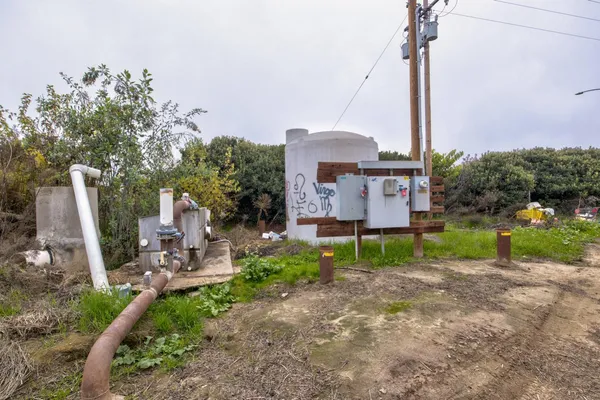 a view of a chair and table in the garden