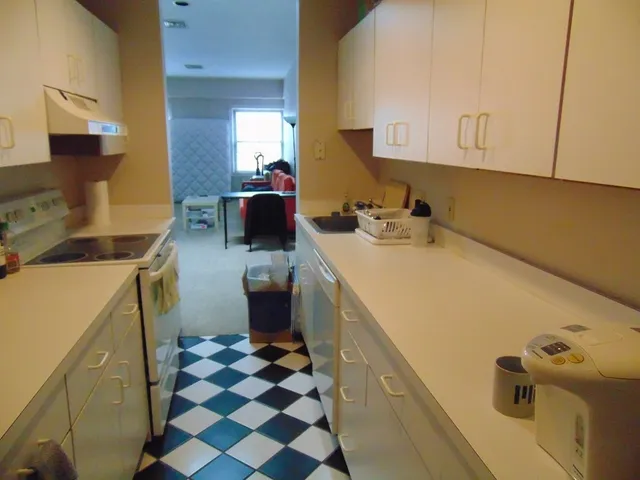 a utility room with sink dryer and washer
