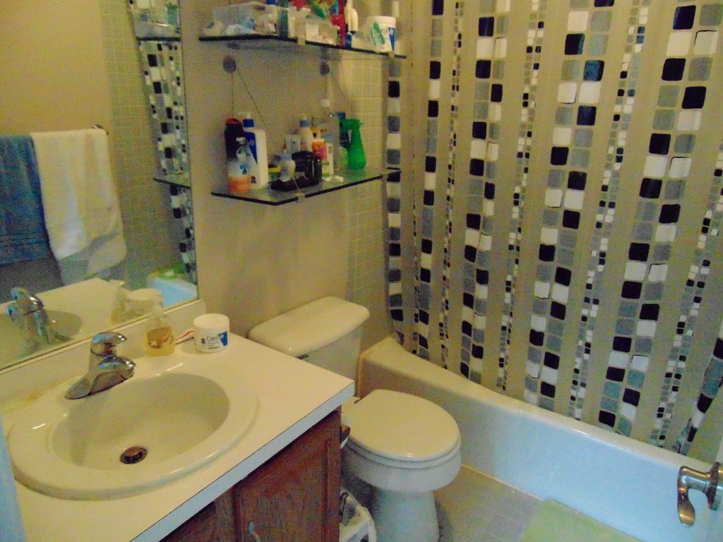 10 Weston Avenue, Unit 430 Quincy, MA 02170 - Photo 8 of 9 a bathroom with a sink and a mirror
