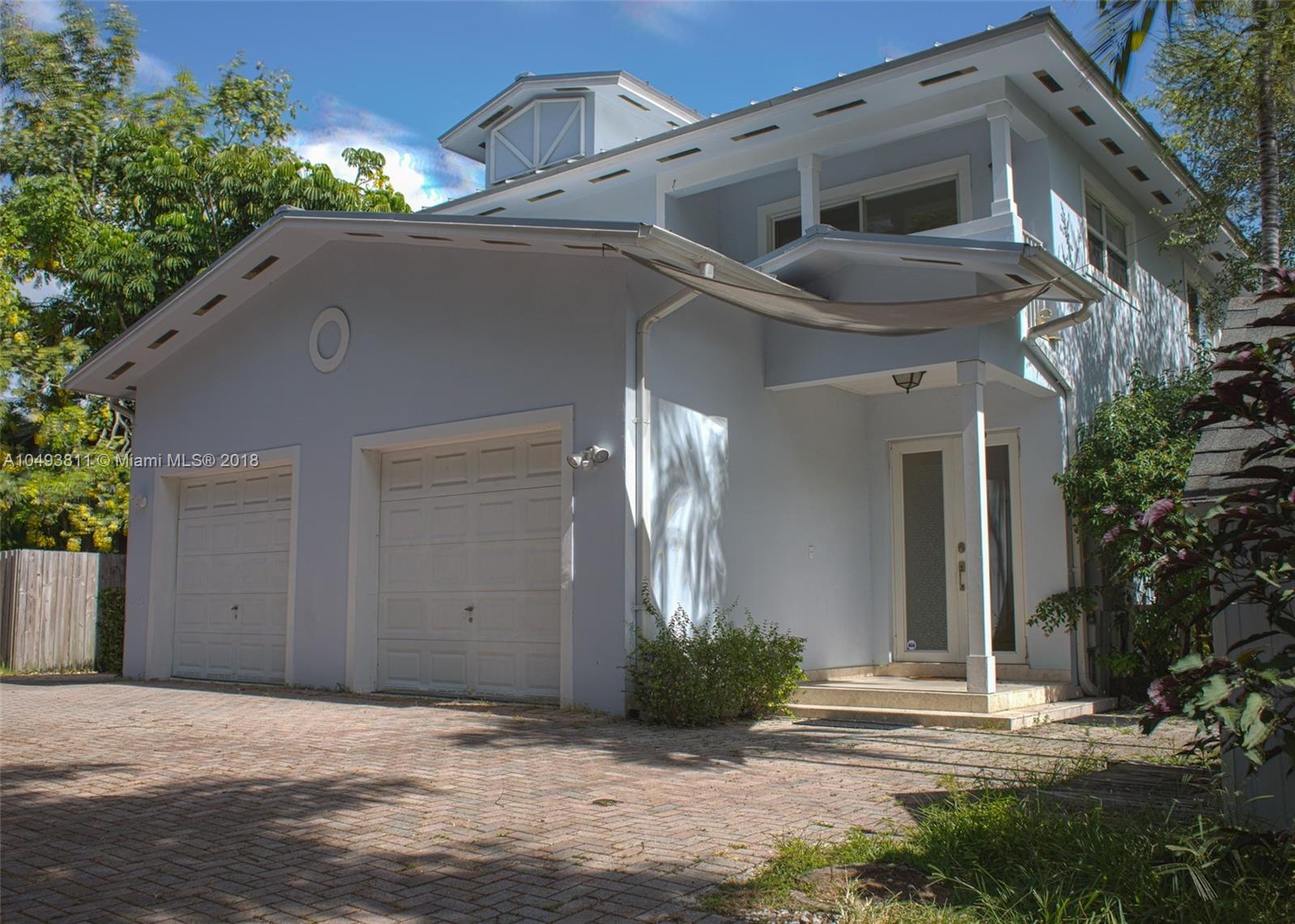 2980 Virginia Street, Unit 2980 Miami, FL 33133 - Photo 1 of 17 a view of a house with a yard
