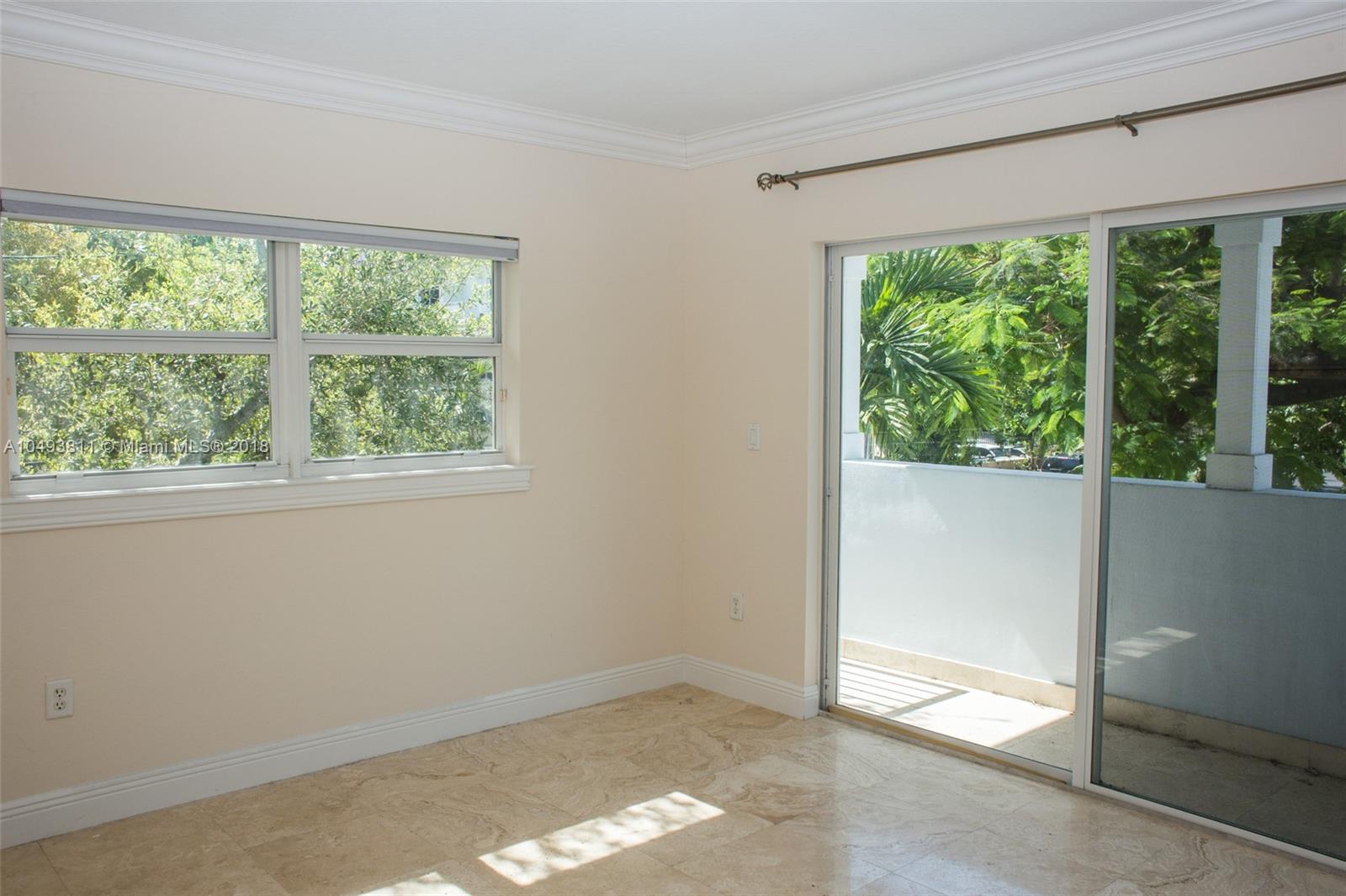 2980 Virginia Street, Unit 2980 Miami, FL 33133 - Photo 14 of 17 an empty room with a window