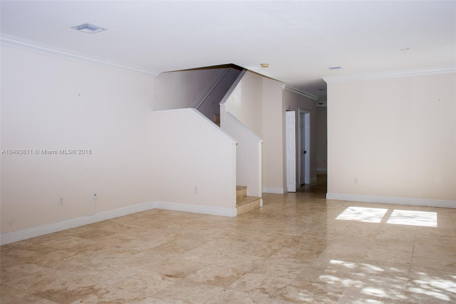 2980 Virginia Street, Unit 2980 Miami, FL 33133 - Photo 2 of 17 a view of a big room with closet