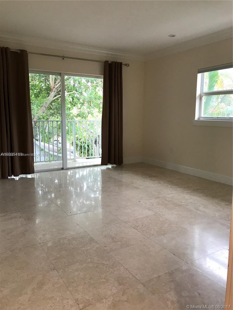 2980 Virginia Street, Unit 2980 Miami, FL 33133 - Photo 9 of 17 a view of an empty room with a window