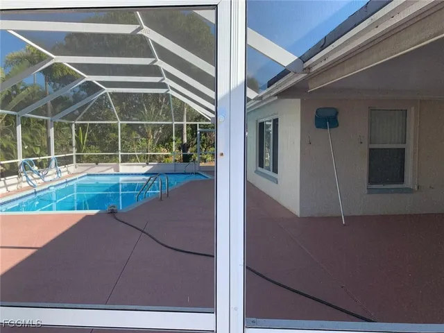 a view of a house with a swimming pool
