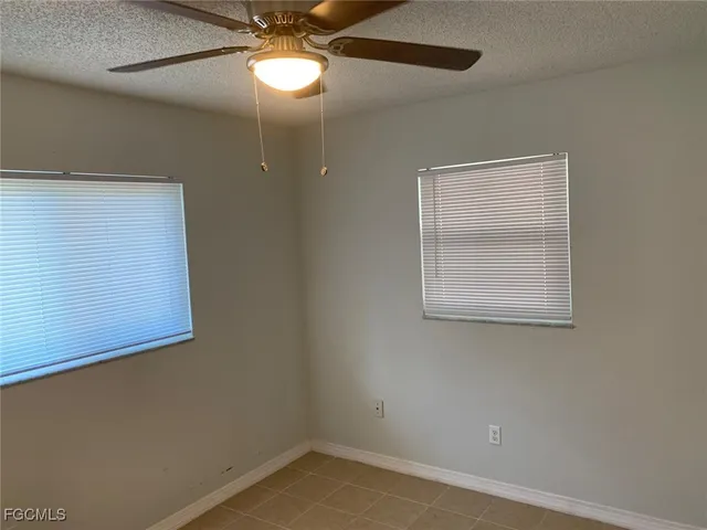 a bathroom with a toilet sink and shower