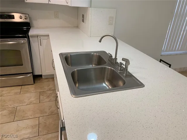 a close view of a sink and washer and dryer