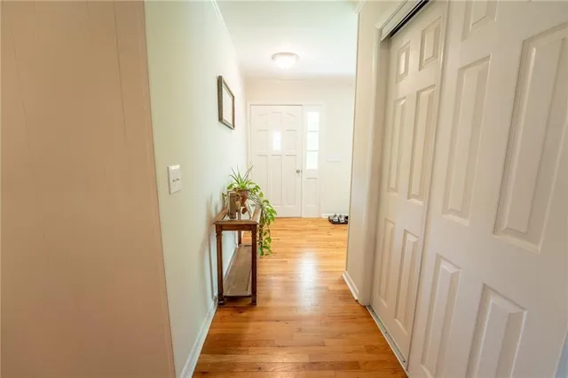 a bathroom with a sink mirror vanity and toilet