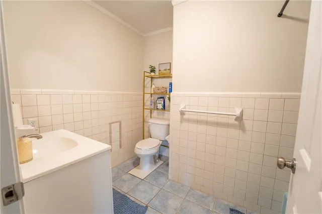 a view of a bedroom with furniture window and wooden floor