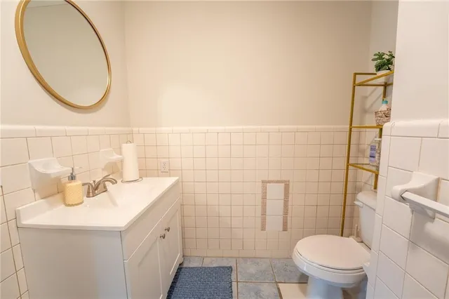 a bedroom with furniture and a rug