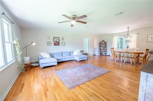 a kitchen with a sink a window and cabinets