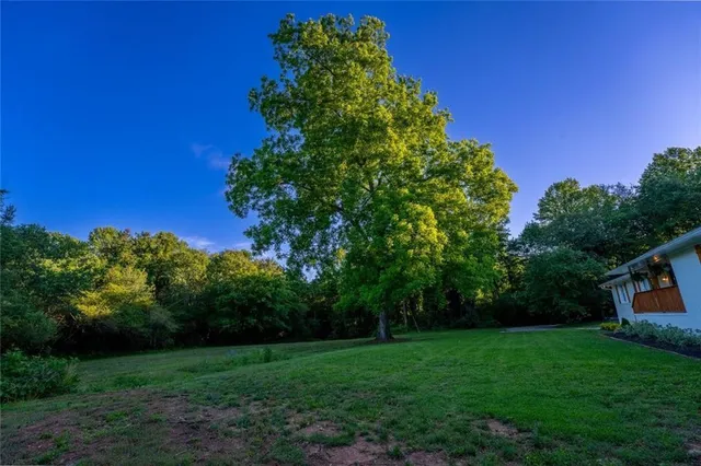 a backyard of a house with barbeque oven
