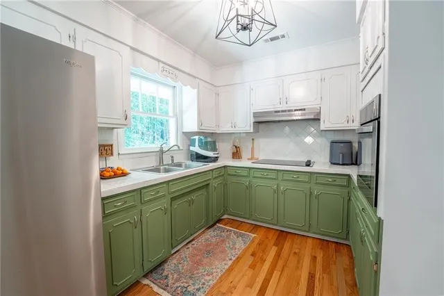 a view of a livingroom with furniture and staircase