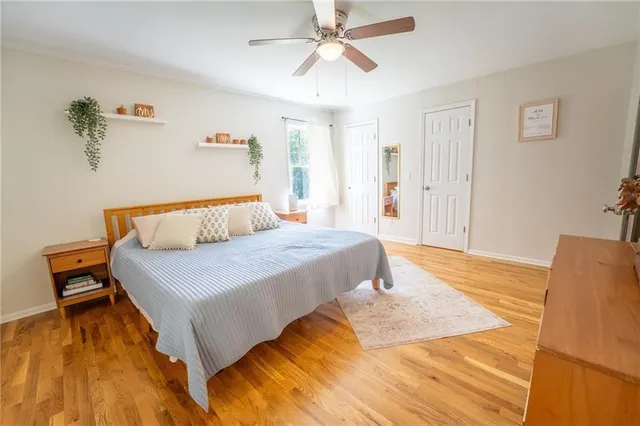 a bathroom with a toilet a sink and a mirror