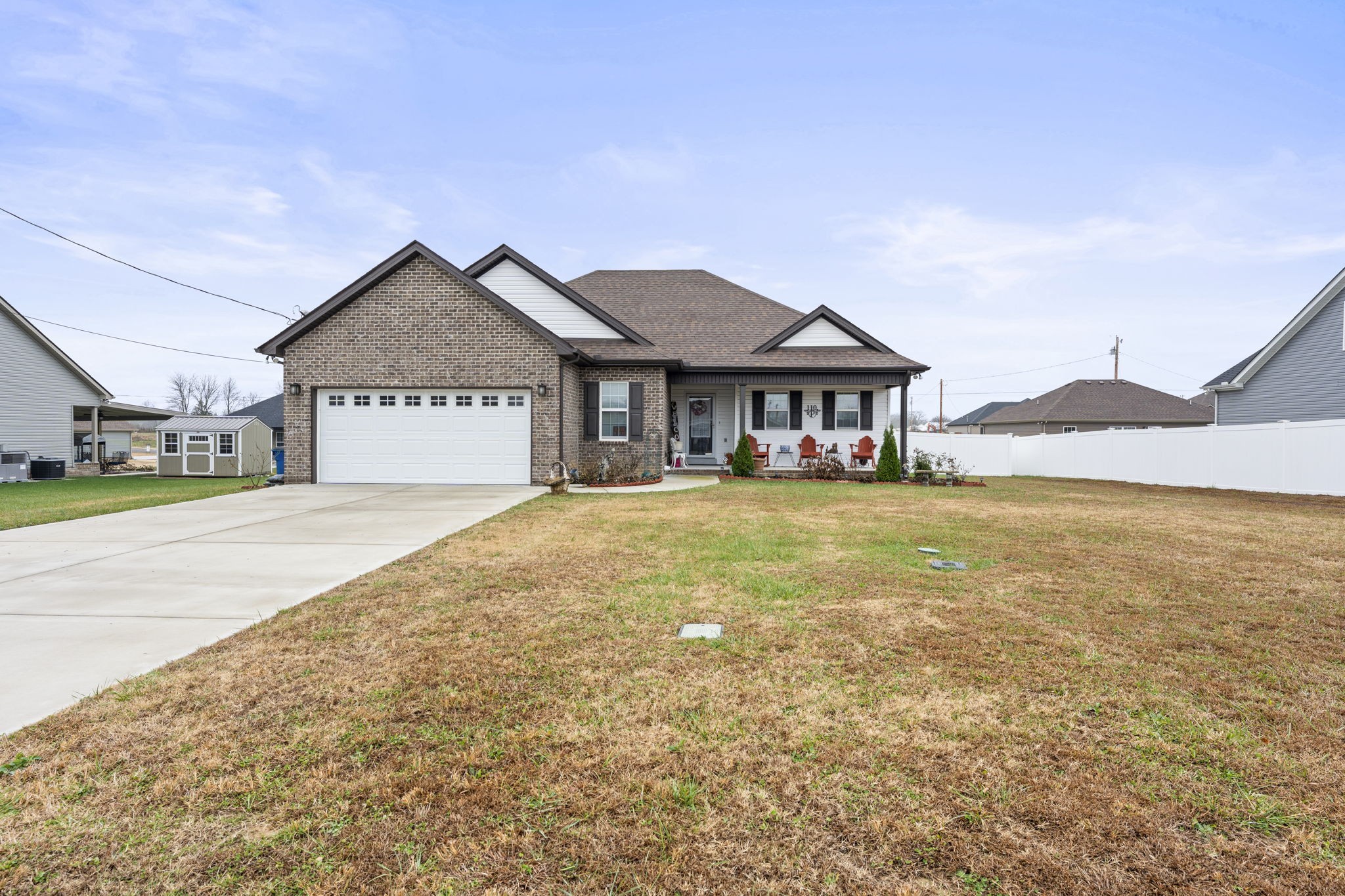 a house view with swimming pool in front of it