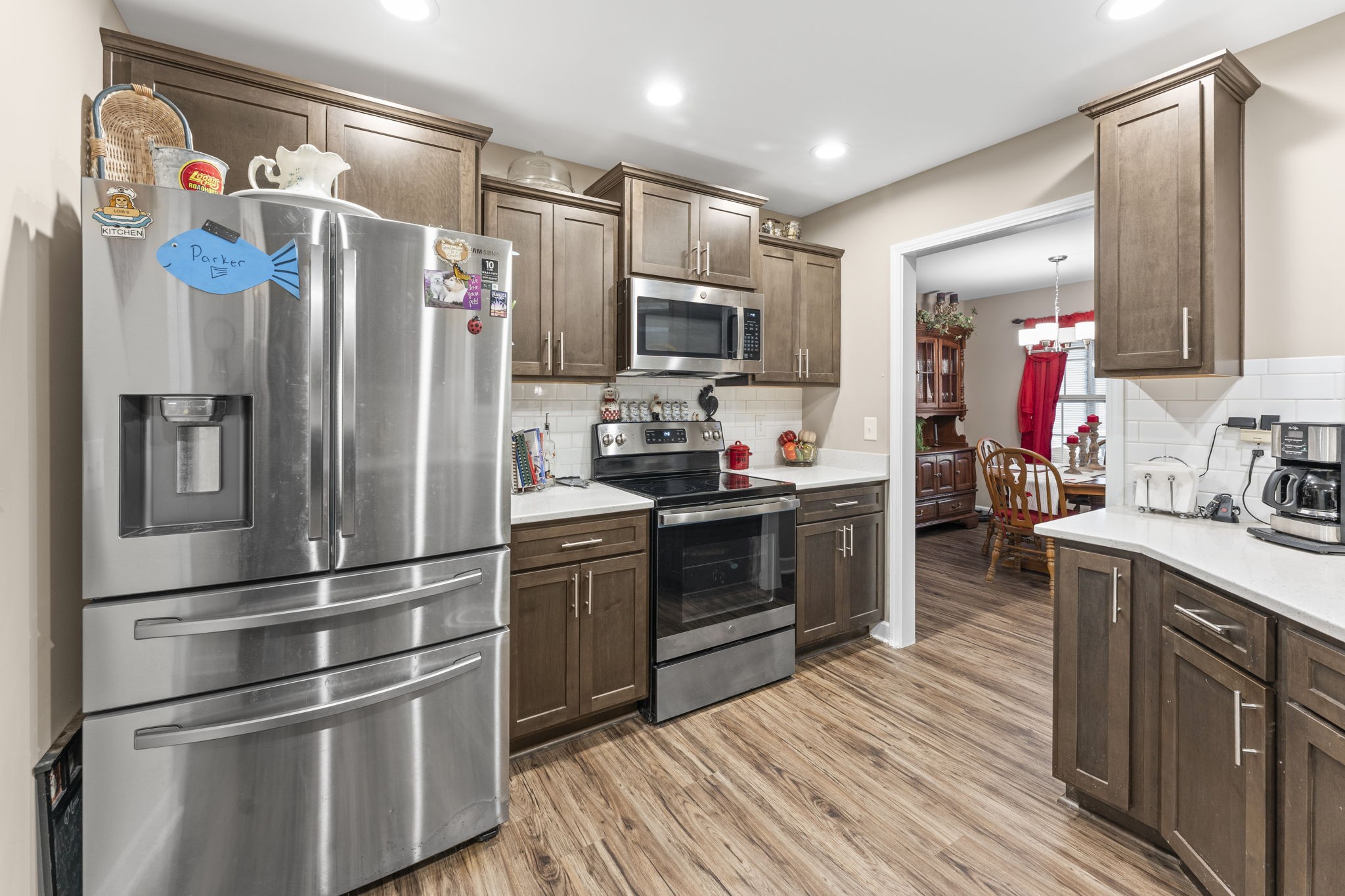 110 Saddle Street Manchester, TN 37355 - Photo 15 of 35 a kitchen with stainless steel appliances and wooden cabinets