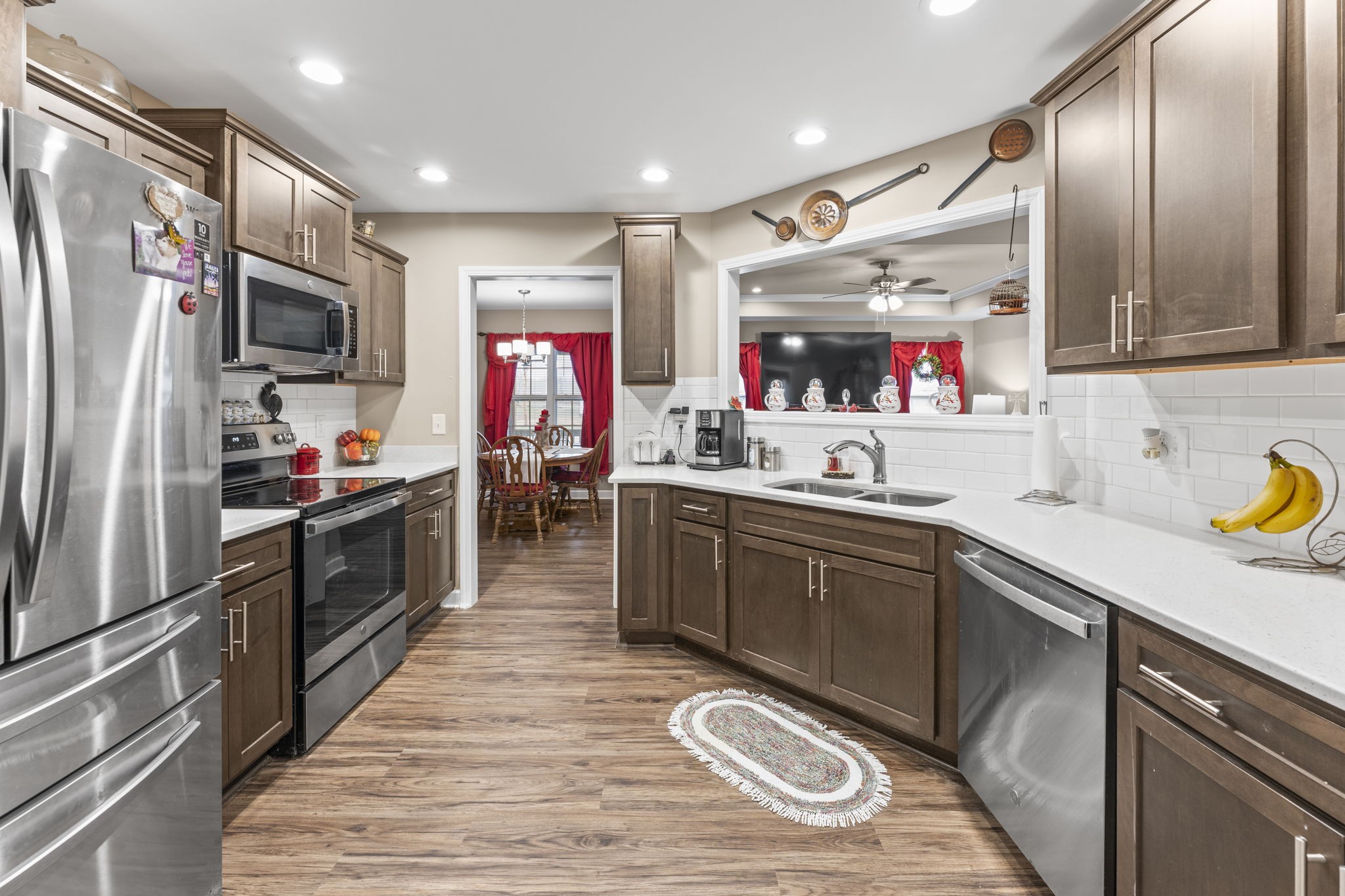 110 Saddle Street Manchester, TN 37355 - Photo 16 of 35 a kitchen with stainless steel appliances granite countertop a sink refrigerator and cabinets