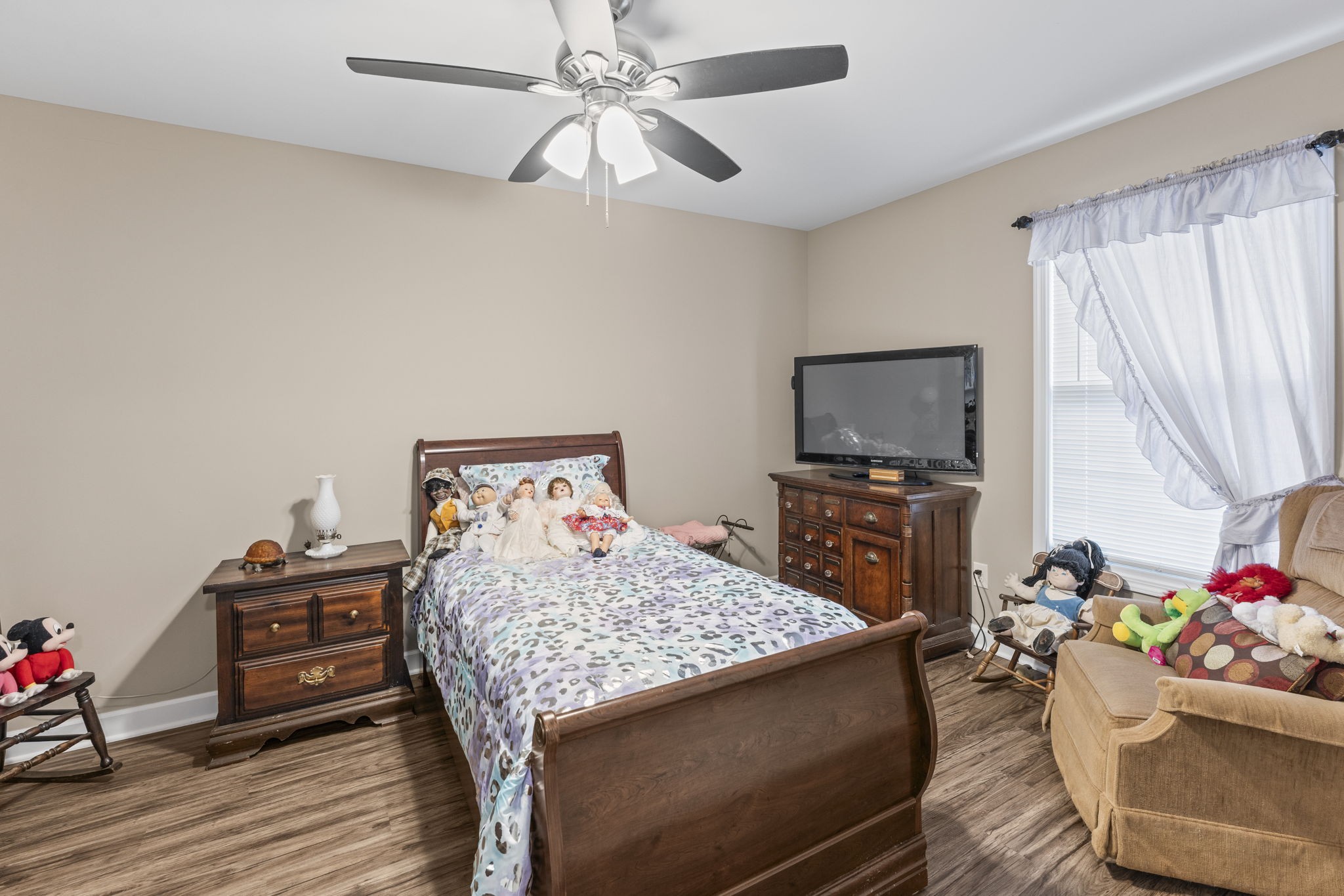 110 Saddle Street Manchester, TN 37355 - Photo 18 of 35 a bedroom with a bed and wooden floor