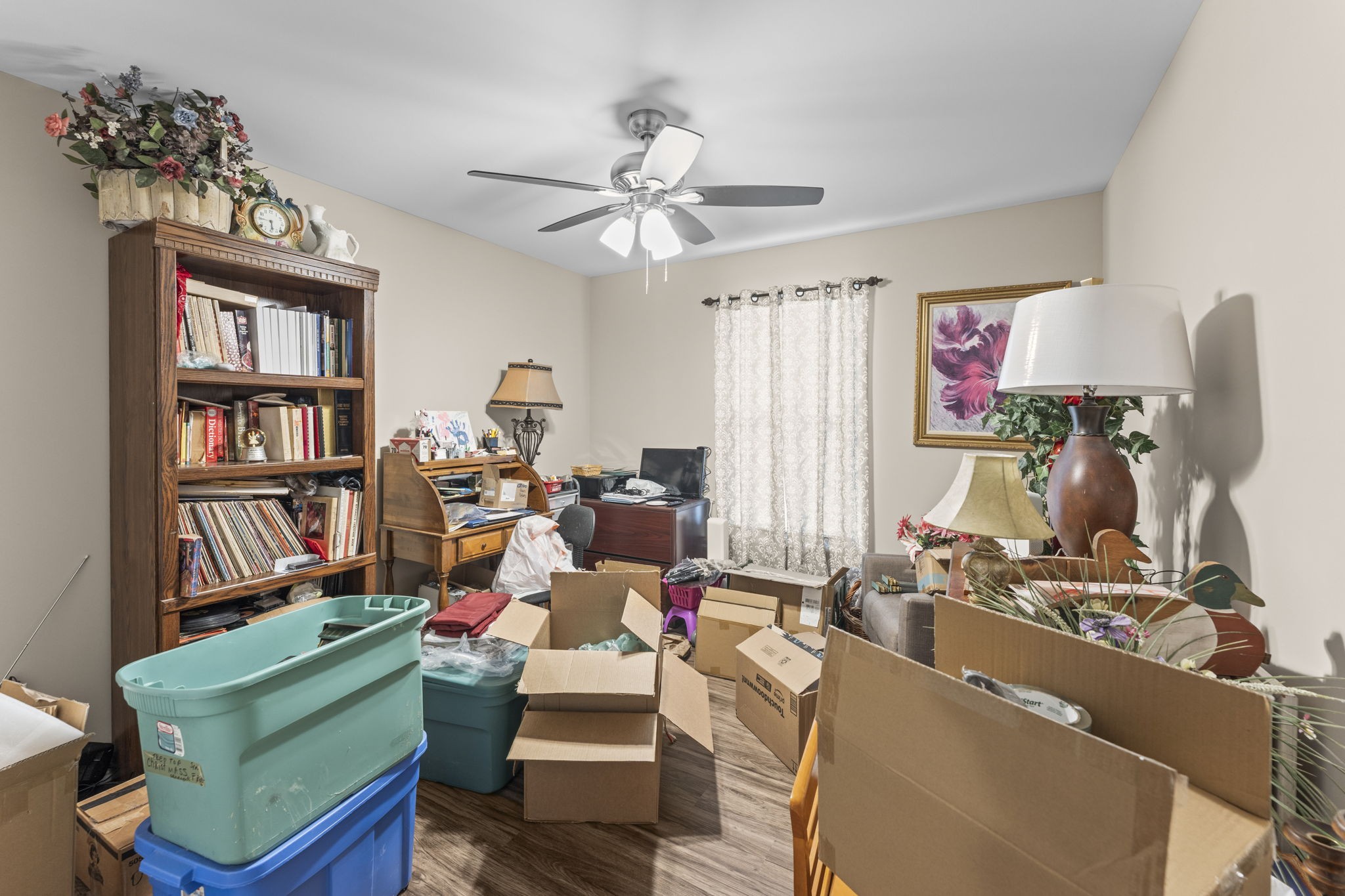 110 Saddle Street Manchester, TN 37355 - Photo 21 of 35 a living room with furniture a bookshelf and a window