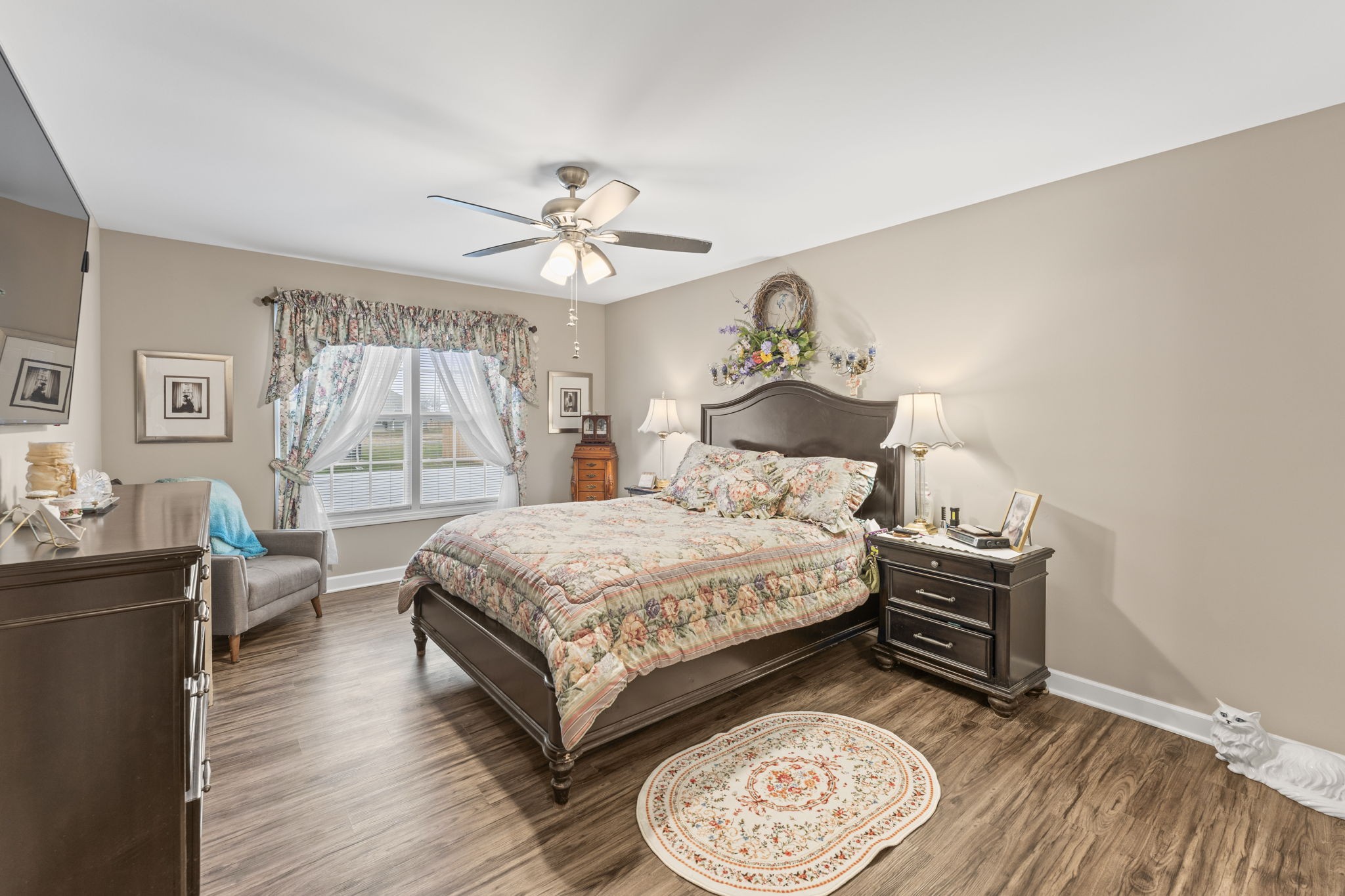 110 Saddle Street Manchester, TN 37355 - Photo 22 of 35 a bedroom with a bed and a chandelier