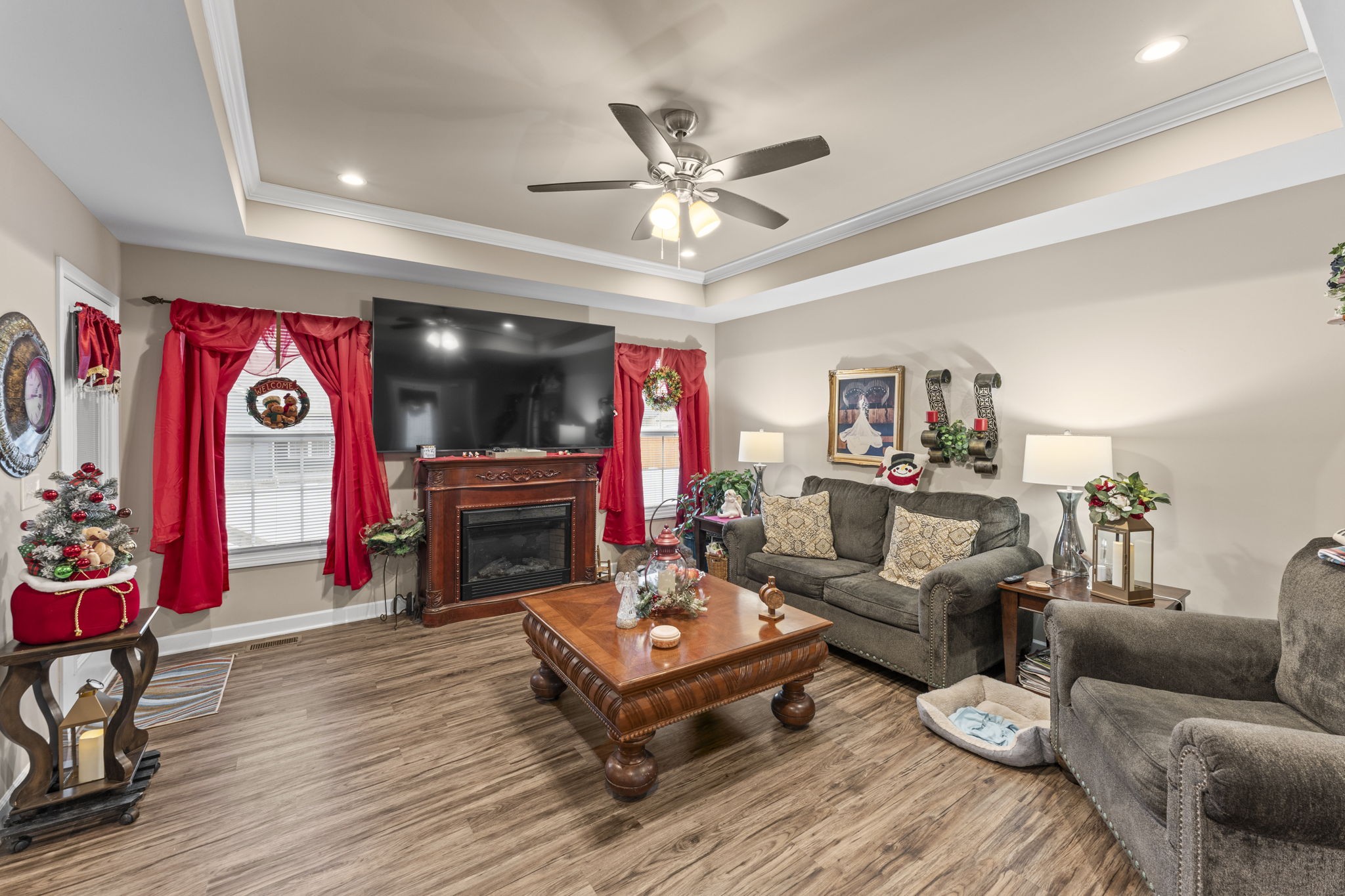 110 Saddle Street Manchester, TN 37355 - Photo 9 of 35 a living room with furniture a flat screen tv and a fireplace