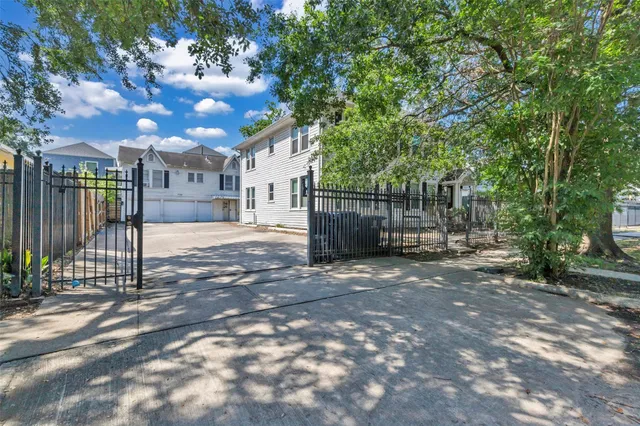 a view of a yard with a tree