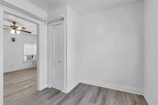 a view of a room with wooden floor
