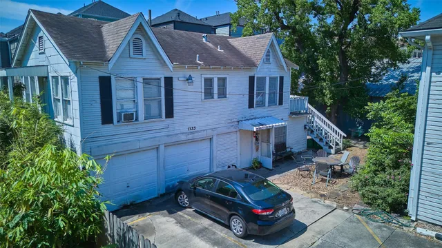 a car parked in front of a house