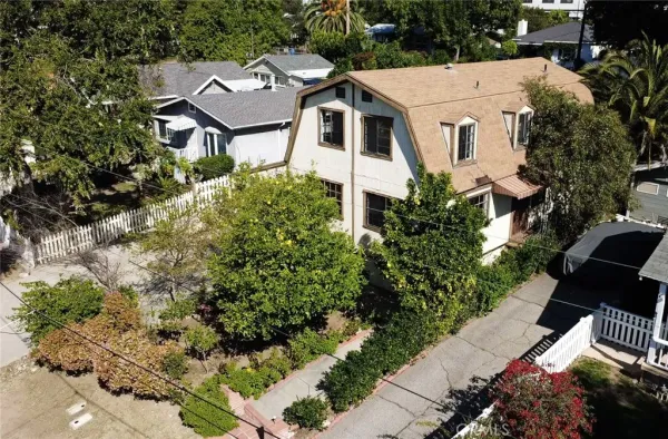 a aerial view of a house with a yard and garden