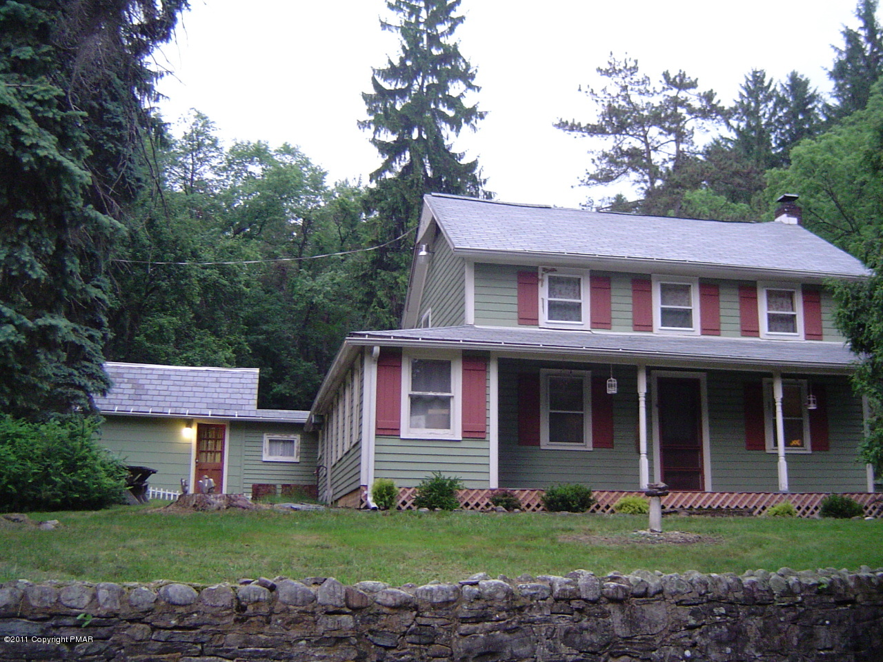 8164 West Rinker Road Stroudsburg, PA 18360 - Photo 1 of 14 a front view of a house with a yard