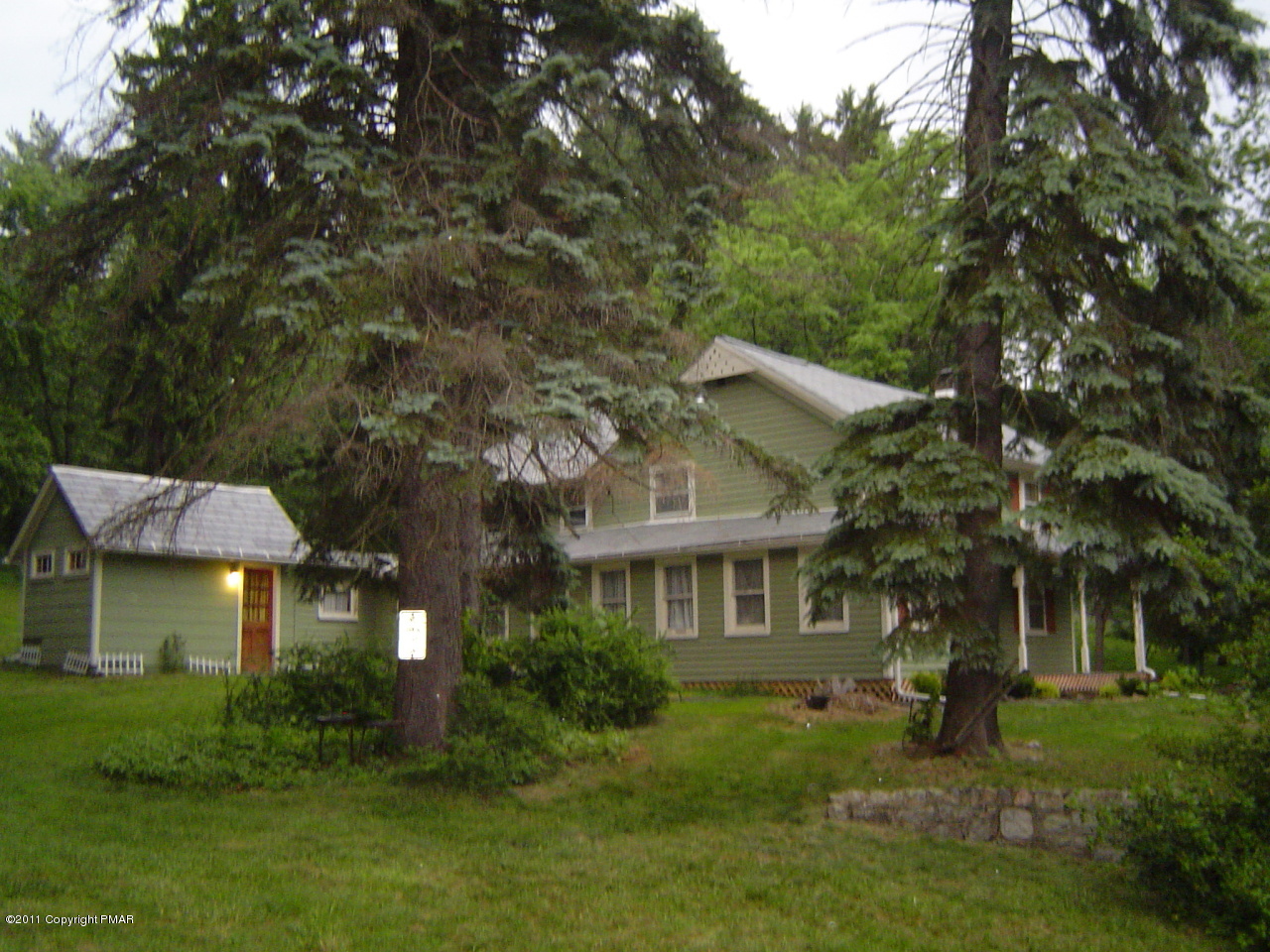 8164 West Rinker Road Stroudsburg, PA 18360 - Photo 12 of 14 a front view of a house with a yard