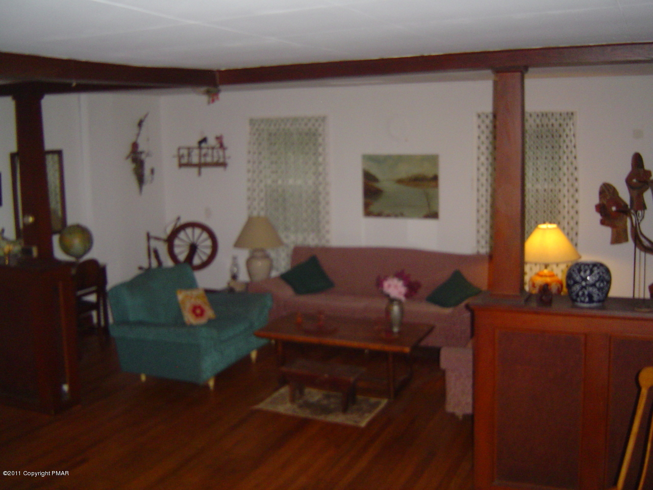 8164 West Rinker Road Stroudsburg, PA 18360 - Photo 2 of 14 a living room with furniture and a mirror