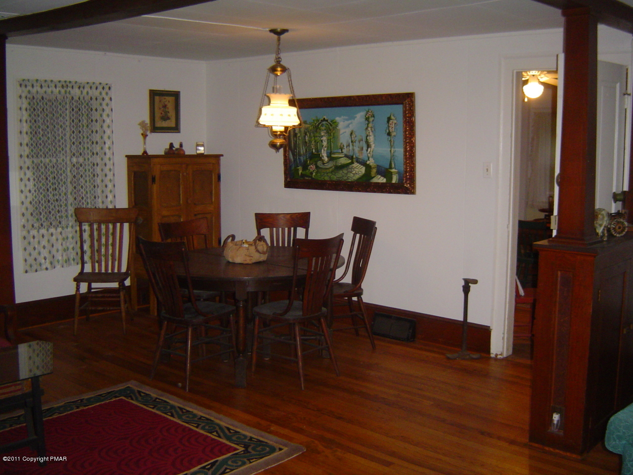 8164 West Rinker Road Stroudsburg, PA 18360 - Photo 3 of 14 a view of a dining room with furniture and wooden floor