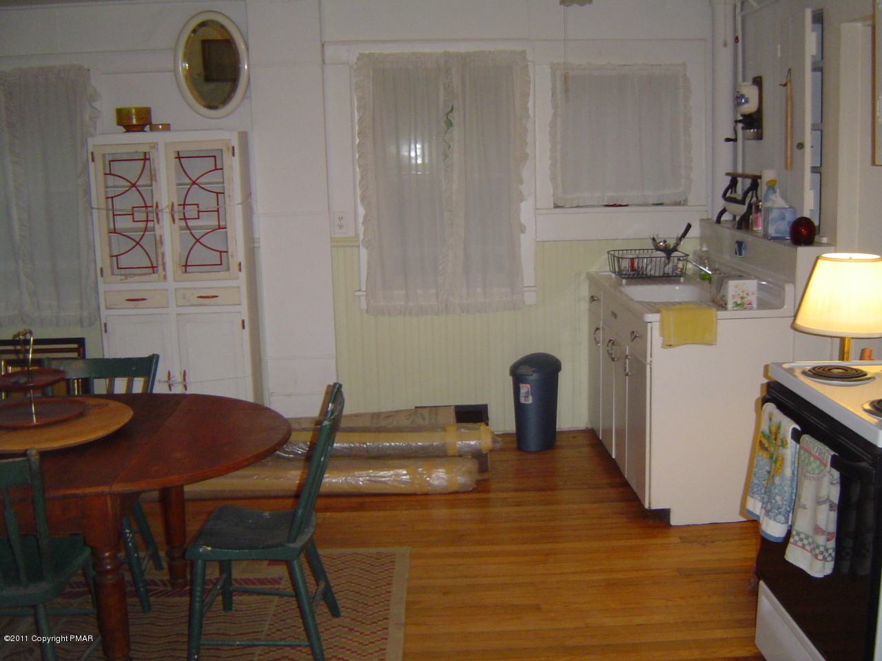 8164 West Rinker Road Stroudsburg, PA 18360 - Photo 4 of 14 a kitchen with a table chairs and a stove