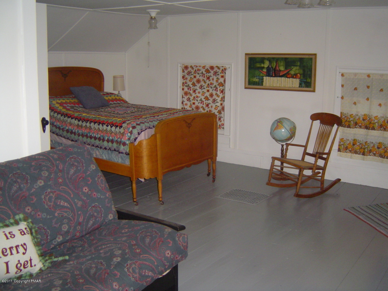 8164 West Rinker Road Stroudsburg, PA 18360 - Photo 5 of 14 a bedroom with a bed and a chair