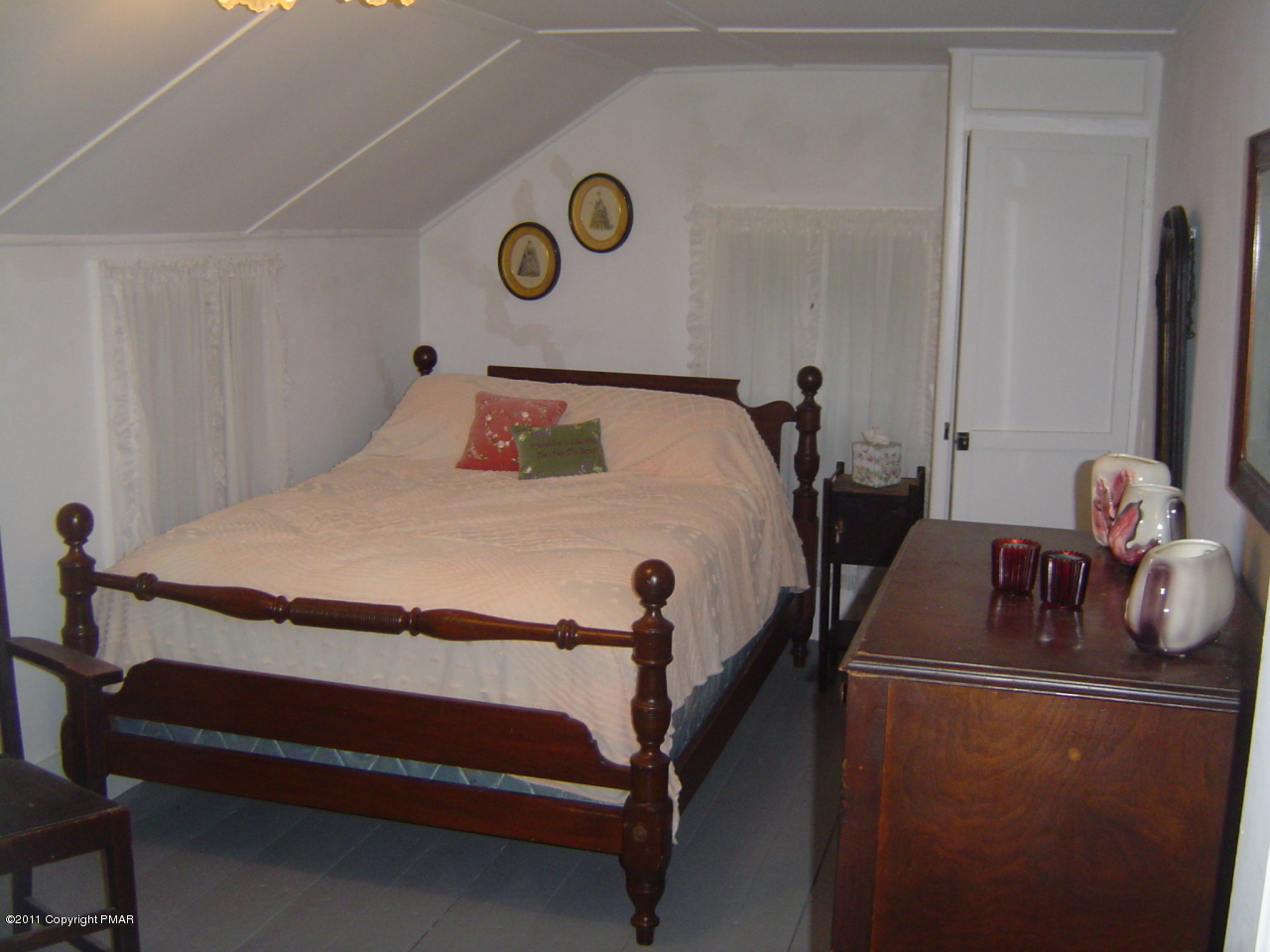 8164 West Rinker Road Stroudsburg, PA 18360 - Photo 6 of 14 a bed room with a bed and a chair
