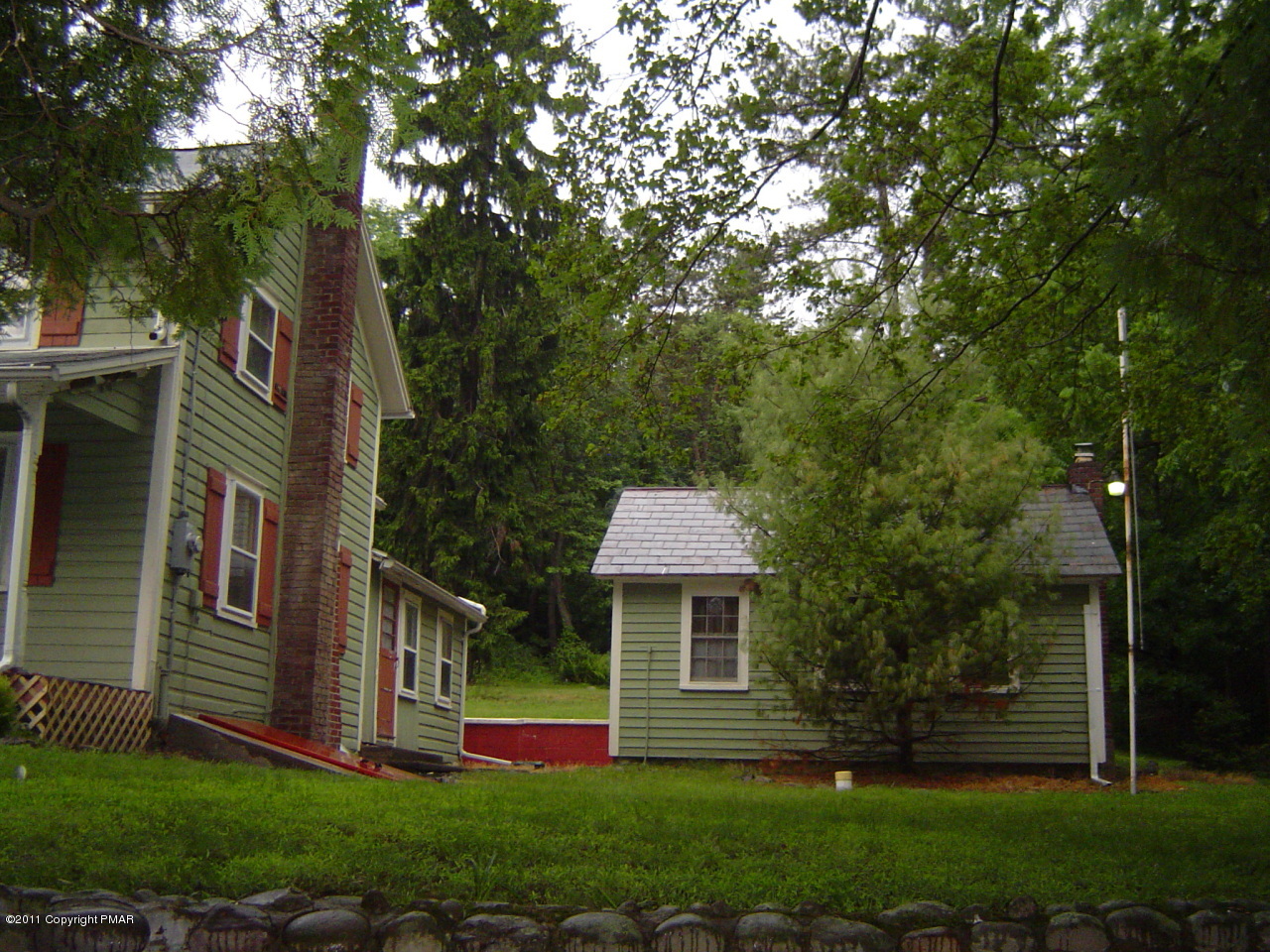 8164 West Rinker Road Stroudsburg, PA 18360 - Photo 10 of 14 front view of a house with a yard