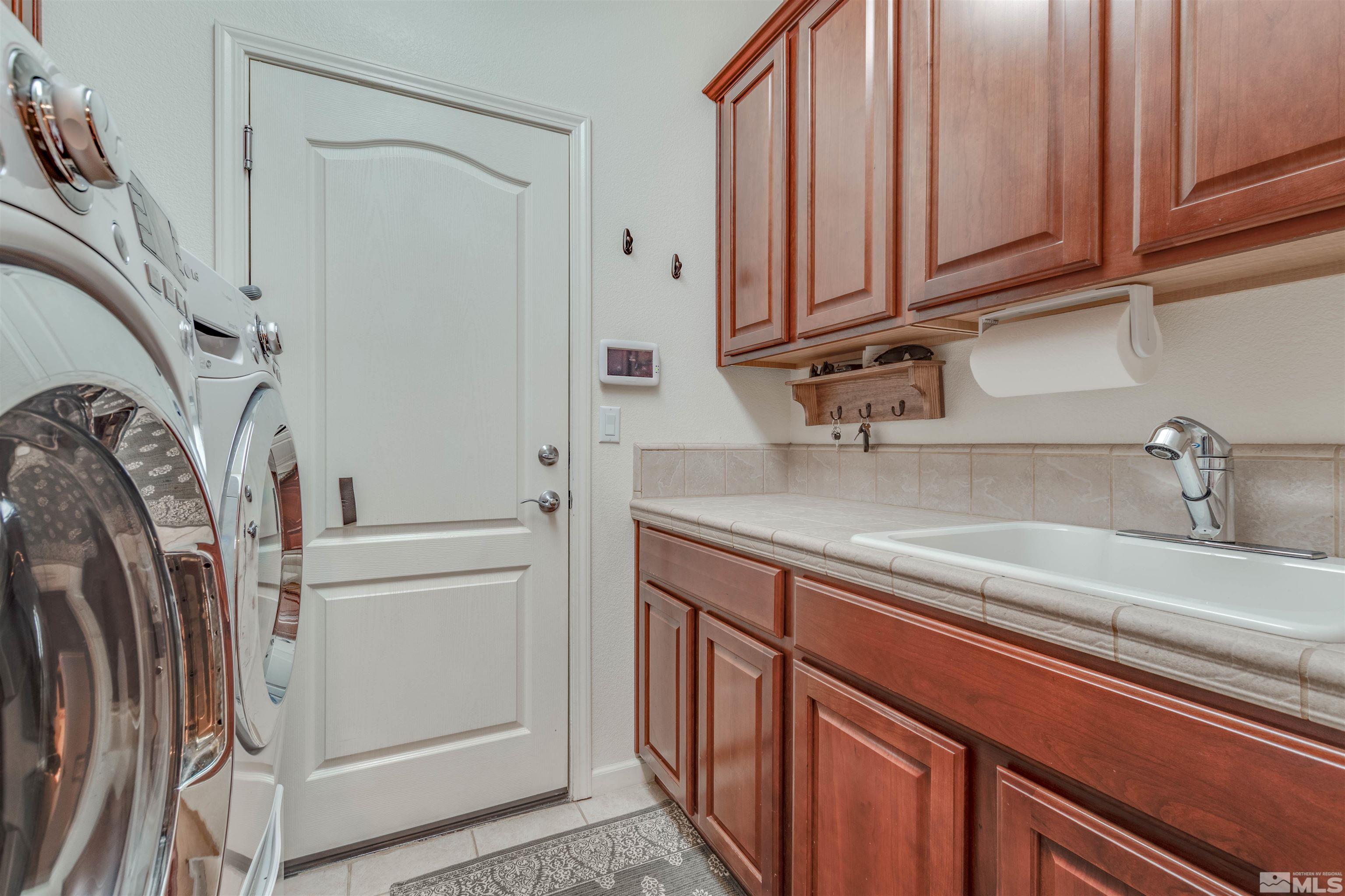 450 Haleb Court Reno, NV 89521 - Photo 20 of 31 a view of a kitchen with washer and dryer