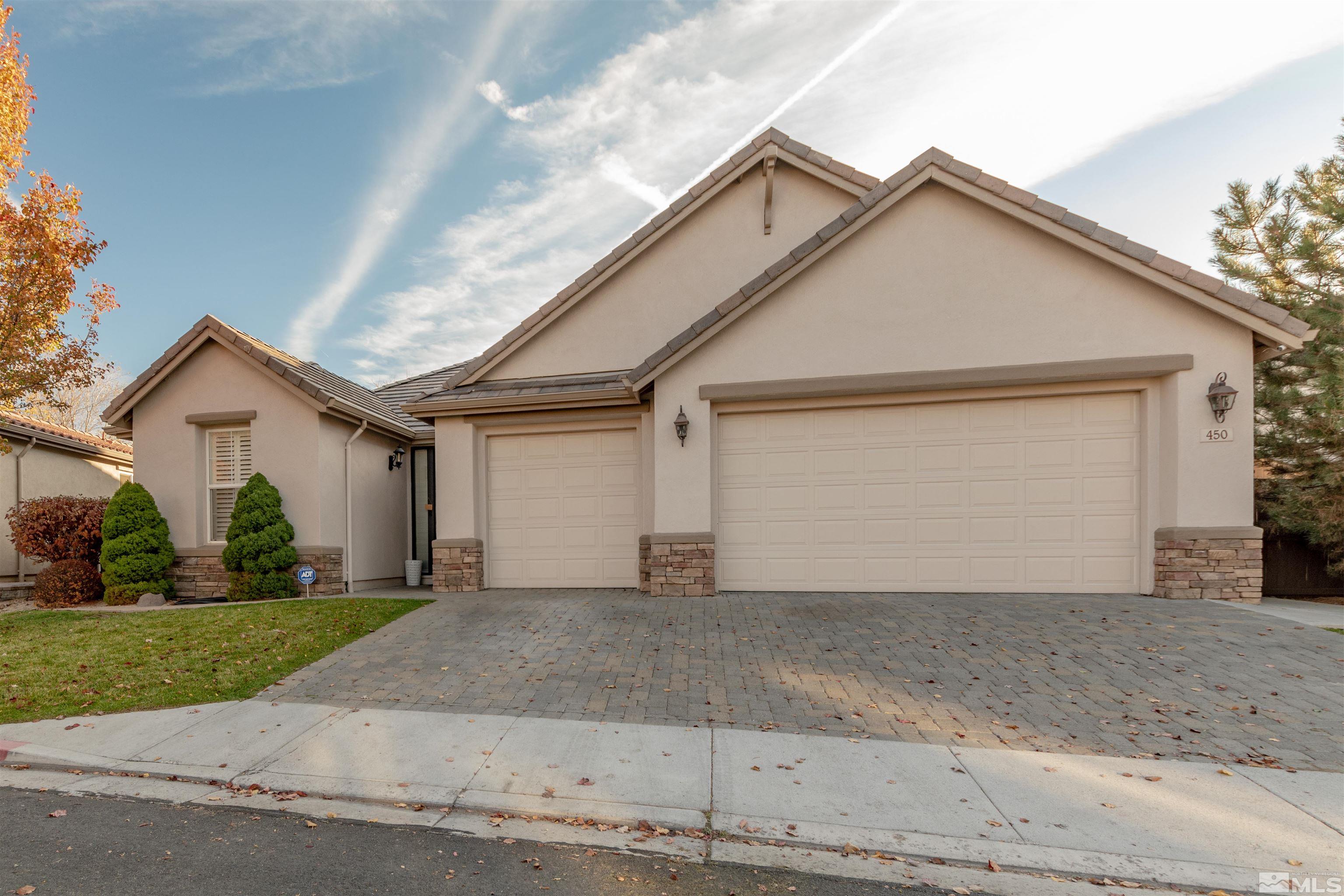 450 Haleb Court Reno, NV 89521 - Photo 2 of 31 a view of a white house with a yard and garage