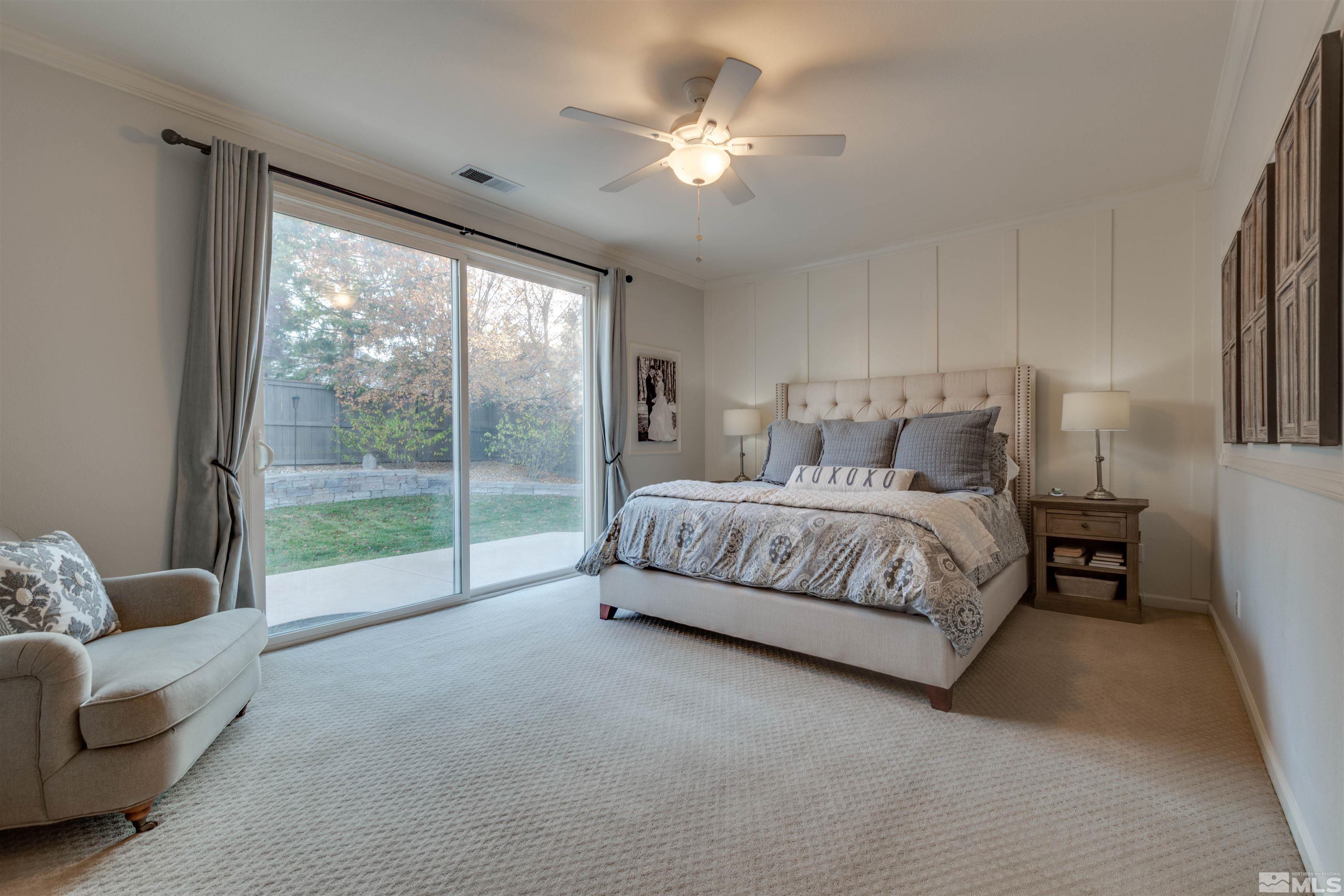 450 Haleb Court Reno, NV 89521 - Photo 22 of 31 a bedroom with a bed couch and window