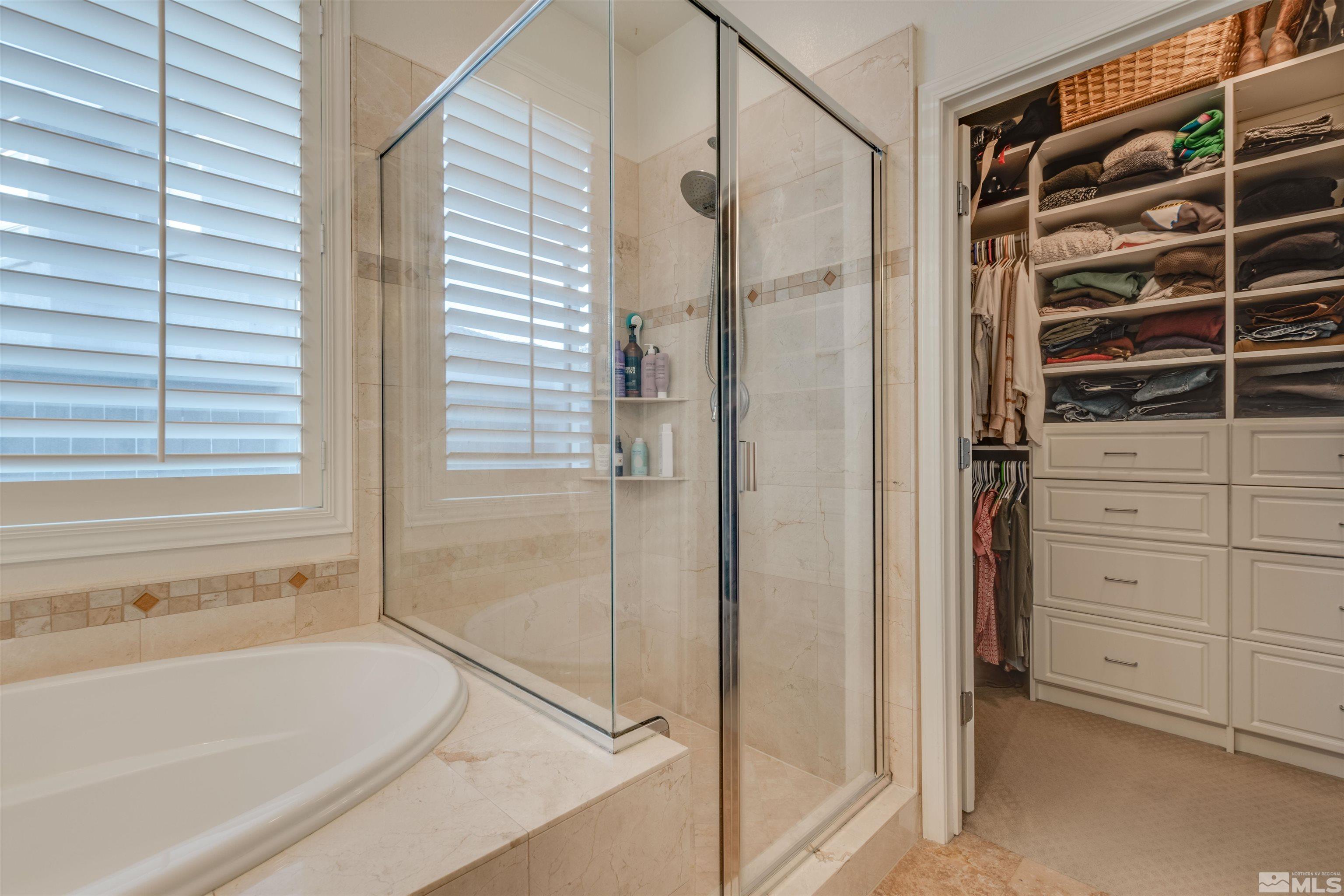 450 Haleb Court Reno, NV 89521 - Photo 25 of 31 a bathroom with a bathtub and a shower