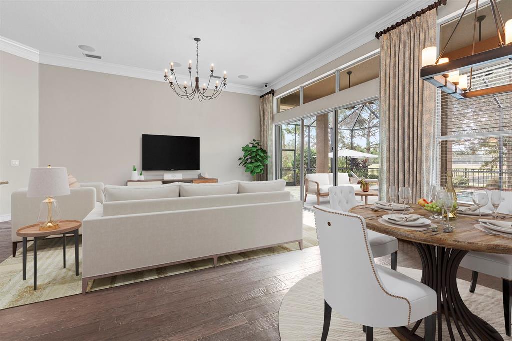 6809 Scenic Drive Apollo Beach, FL 33572 - Photo 17 of 94 a living room with a dining table furniture and a flat screen tv