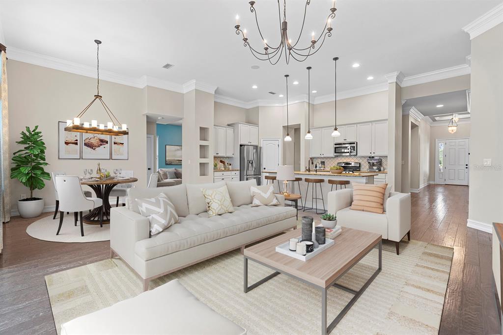 6809 Scenic Drive Apollo Beach, FL 33572 - Photo 3 of 94 a living room with furniture a chandelier and a chandelier